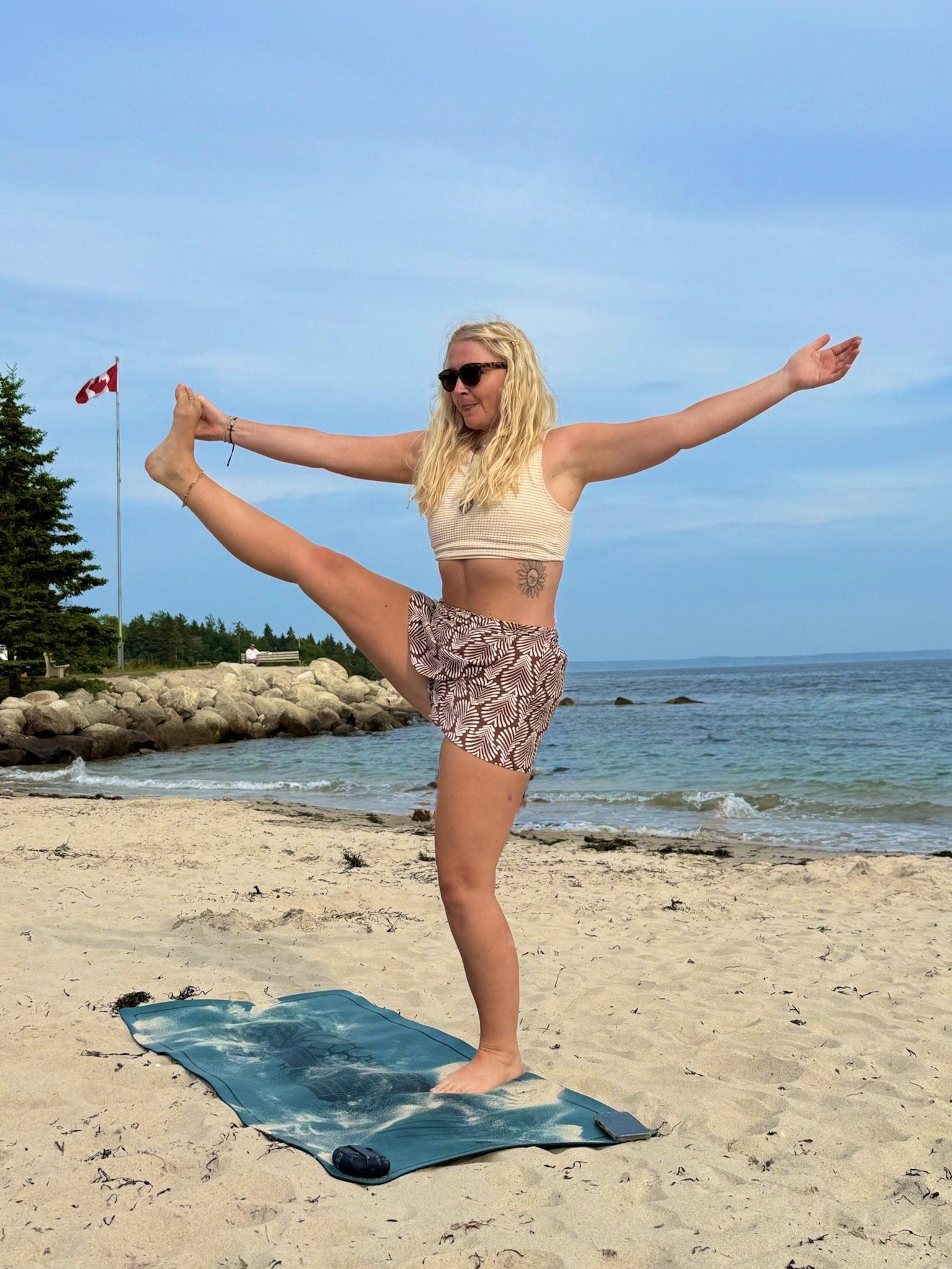 Outdoor yoga class at sunset
